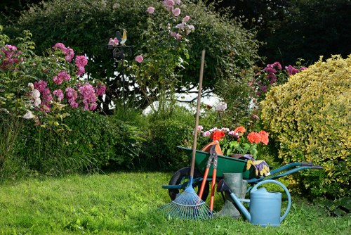 Gardening team preparing to trim a hedge